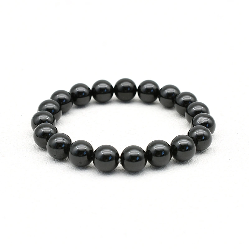 Black Spinel Bracelets Wholesale – 10mm polished black round bead bracelet on a white background.
