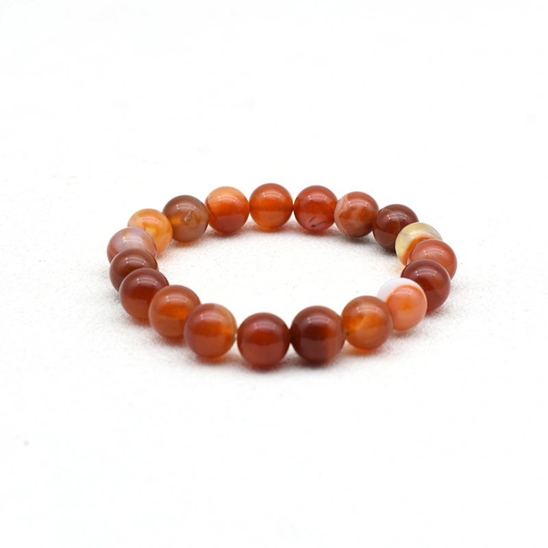 Carnelian Bracelet Wholesale with 10mm round beads showing varied red and orange banding
