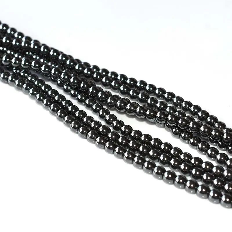 Hematite Beads Wholesale – 4mm polished round bead strands on a white background