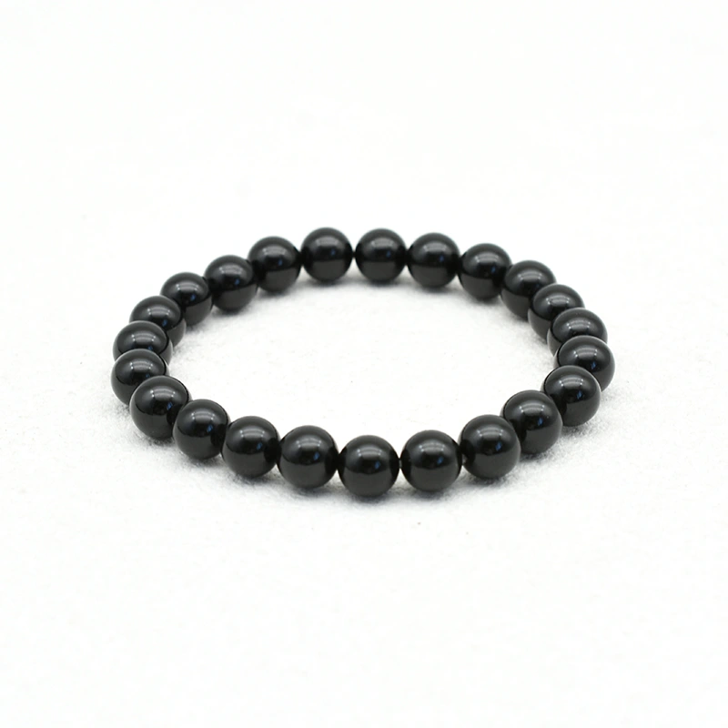 Black Spinel Bracelets Wholesale – 8mm polished black round bead bracelet on a white background.
