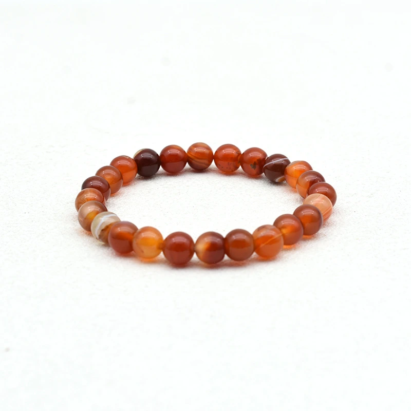 Carnelian Bracelet Wholesale with 8mm round red banded agate beads on a white background