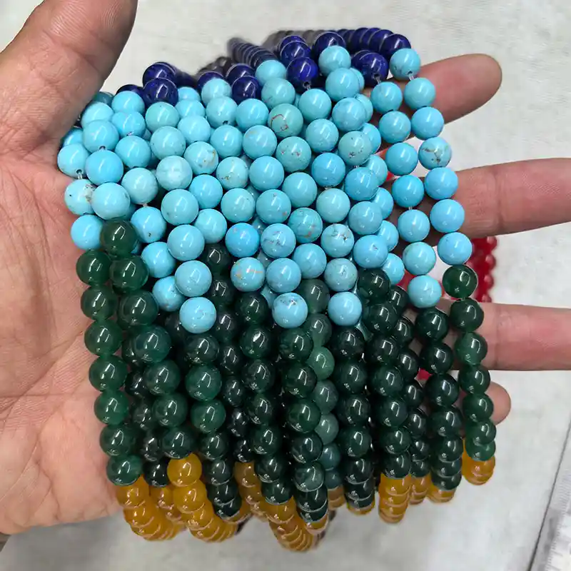 Chakra Beads Wholesale – 8 mm bead strands showing contrasting colors and stone patterns