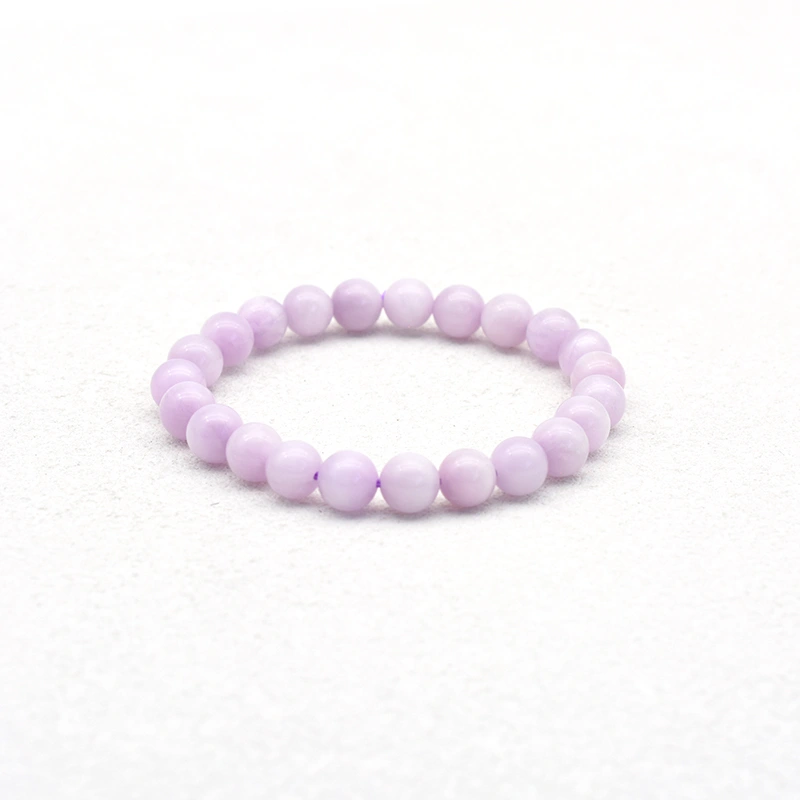 Kunzite Bracelet Wholesale with 8mm pale purple round beads on a white background
