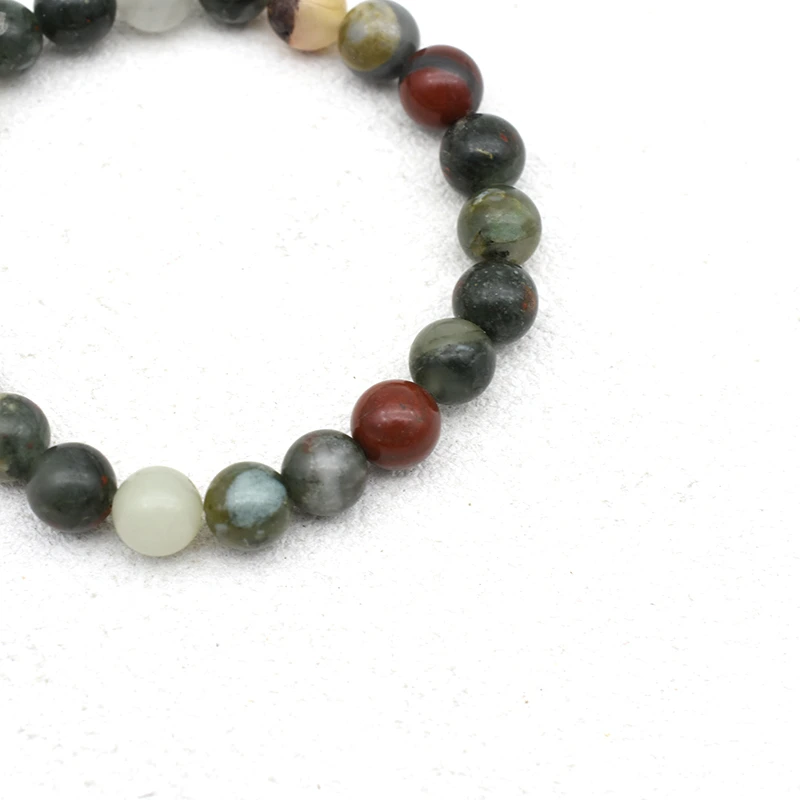 African Bloodstone Bracelet Wholesale close-up showing round beads with varied colors and surface patterns