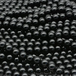 Black Spinel Beads Wholesale – detailed view of polished round black beads on parallel strands