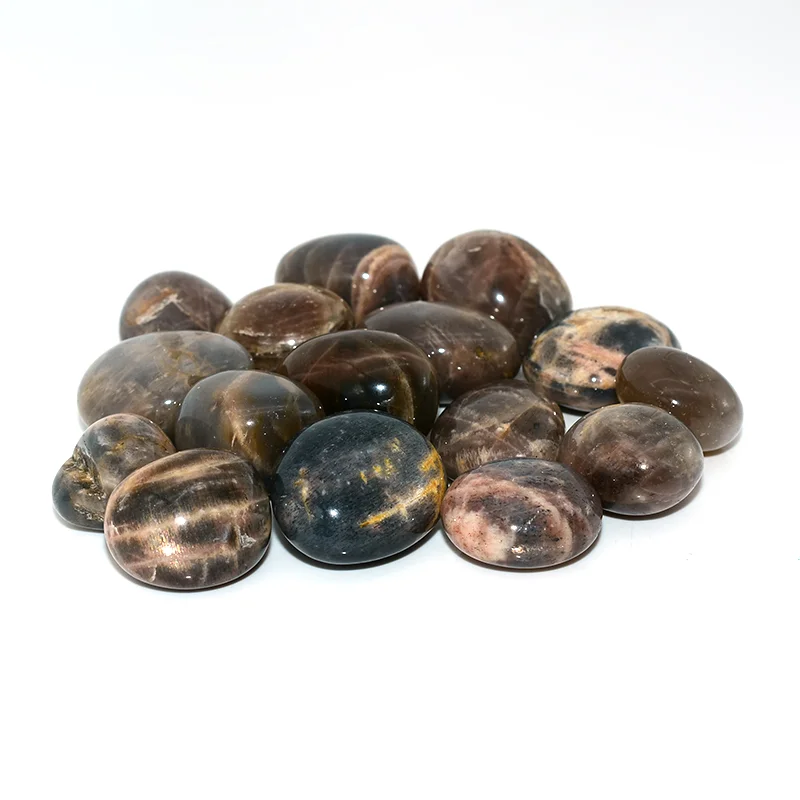 Black Sunstone Tumbled Stone Wholesale – close-up of rounded stones with natural patterns and a glossy finish