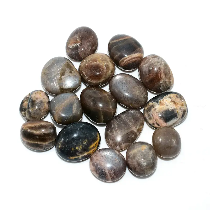 Black Sunstone Tumbled Stone Wholesale – top view of assorted gray and brown polished stones