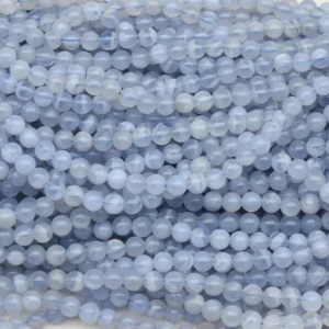 Blue Lace Agate Beads Wholesale – multiple round bead strands arranged in rows with visible blue and white pattern variations.