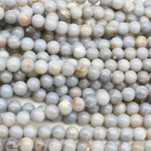 Blue Opal Beads Wholesale – close-up of polished round beads with pale blue, cream and brown details