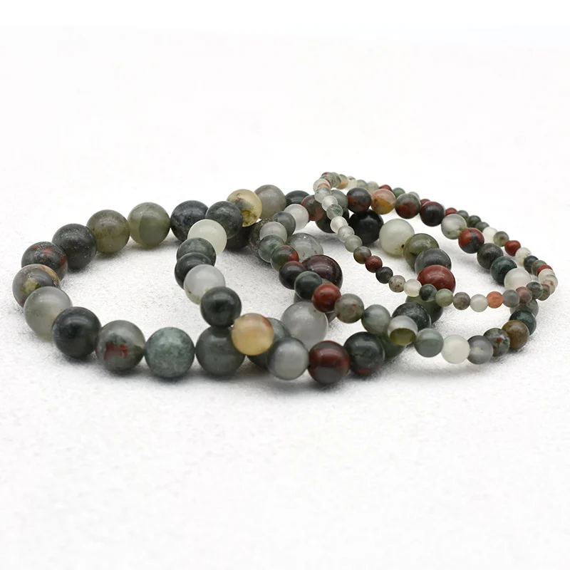 African Bloodstone Bracelet Wholesale showing overlapping bracelets in different bead sizes