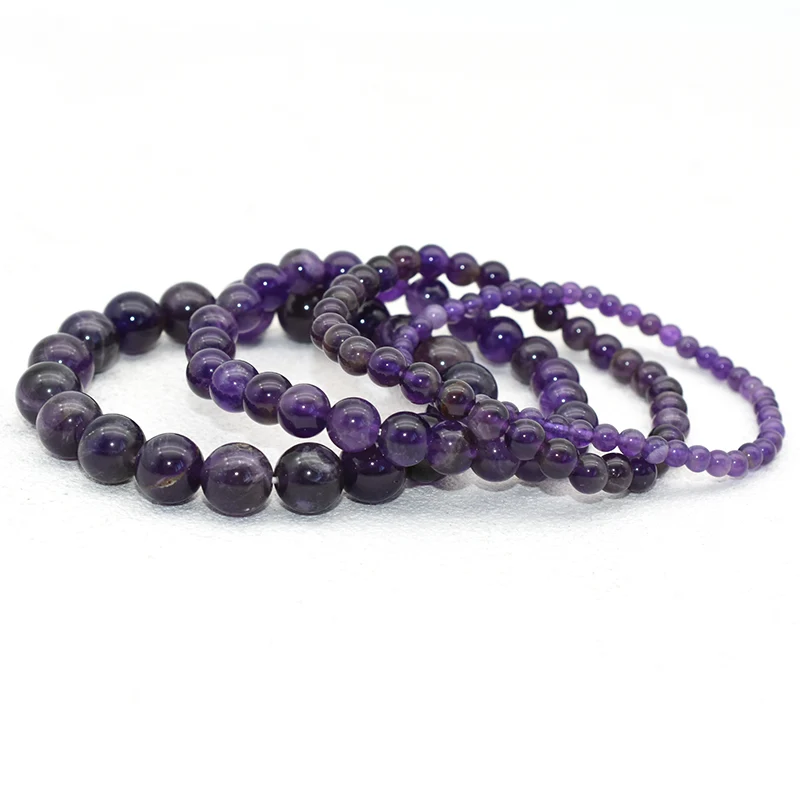 Amethyst Bracelet Wholesale collection showing purple round bead bracelets in multiple bead sizes