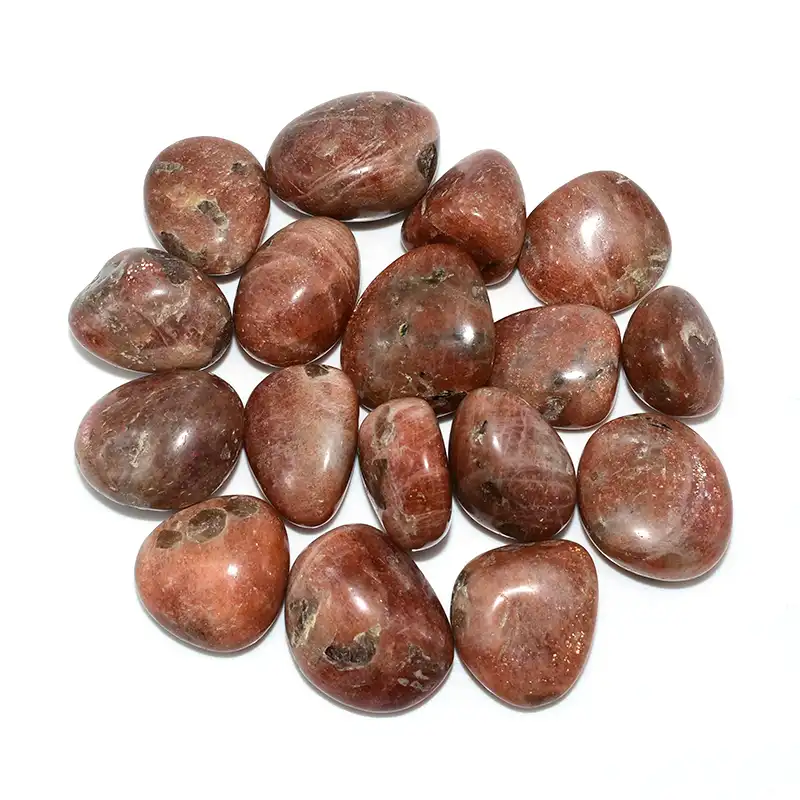 Golden Sunstone Tumbled Stone Wholesale – top view of polished stones with golden sparkles
