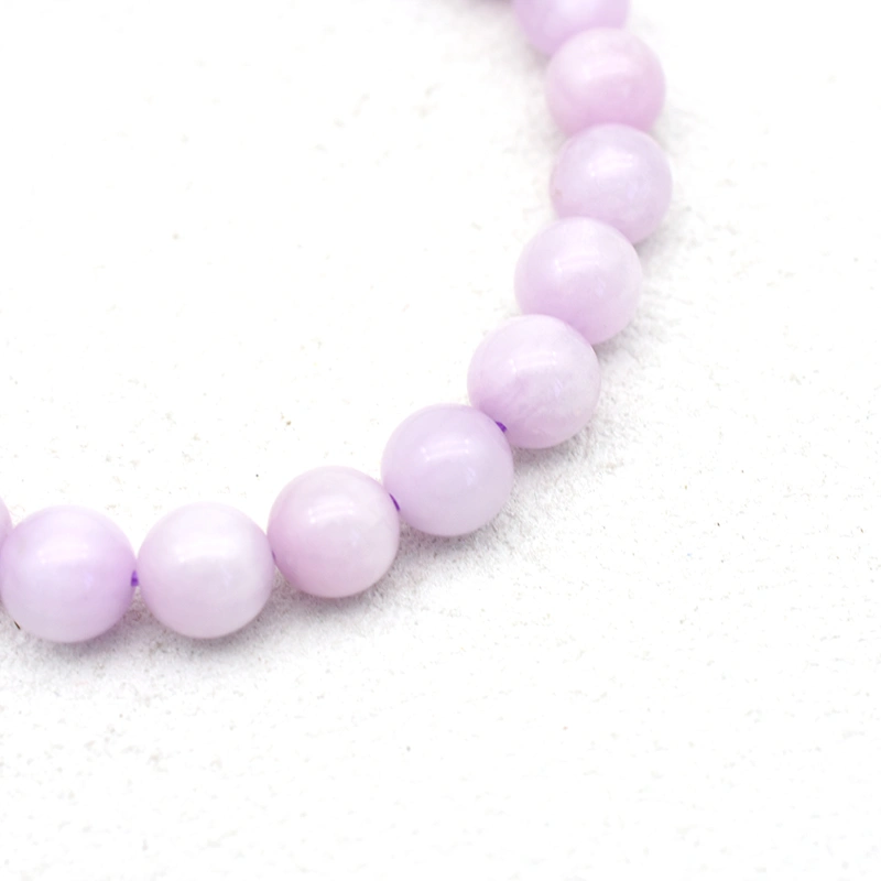 Kunzite Bracelet Wholesale close-up showing pale purple round beads with white areas