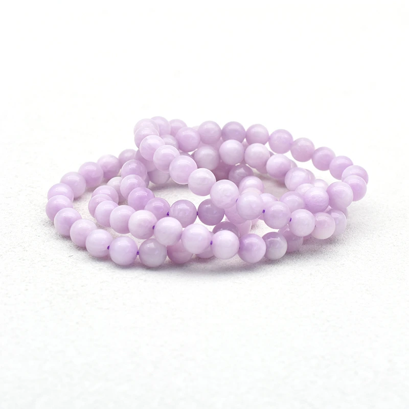 Kunzite Bracelet Wholesale showing overlapping pale purple beaded bracelets