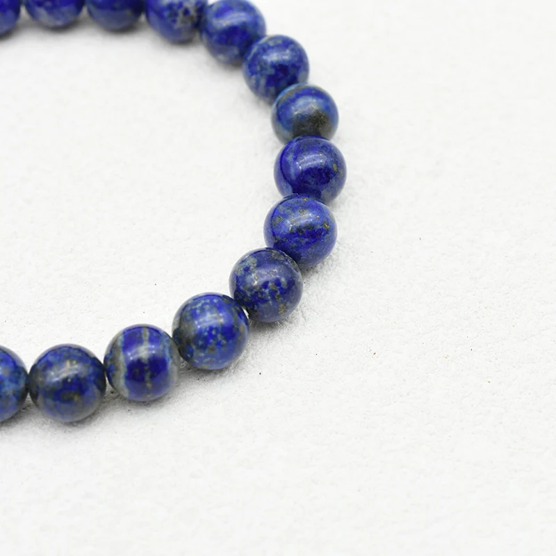 Lapis Lazuli Bracelet Wholesale close-up showing blue beads with white patches and gold-colored flecks