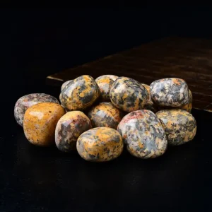 Leopard Skin Tumbled Stone Wholesale – patterned stones displayed on a wooden tray