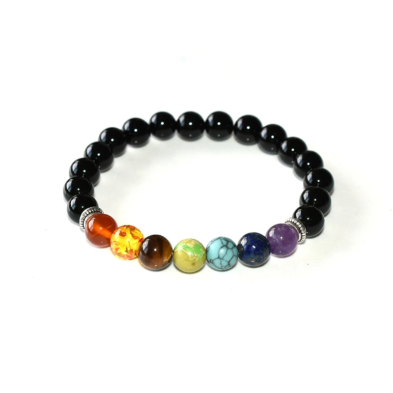 Mens Chakra Bracelet Wholesale angled view showing polished black round beads and a seven-color bead section