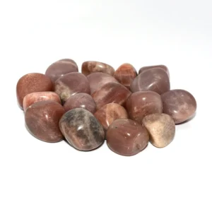 Sunstone Tumbled Stone Wholesale – group of orange and brown polished stones on a white background