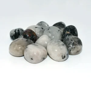 Tumbled Tourmalinated Quartz Wholesale – assorted white and translucent quartz stones on a white background