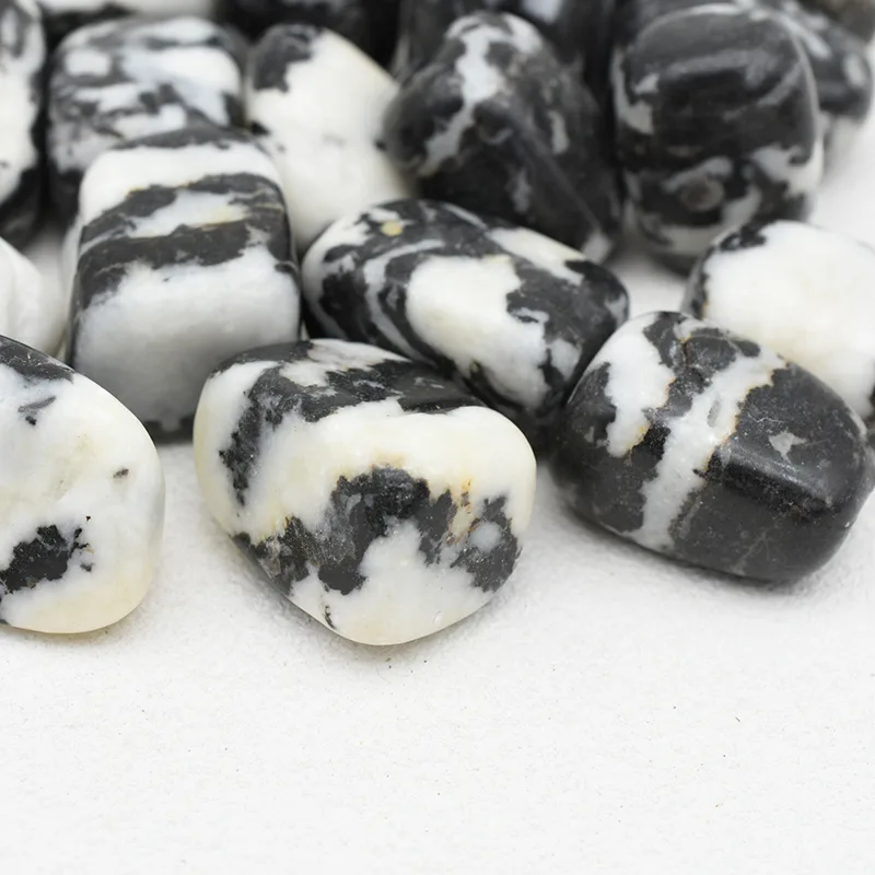 Zebra Jasper Tumbled Stone Wholesale – close-up of polished stones with varied black and white markings